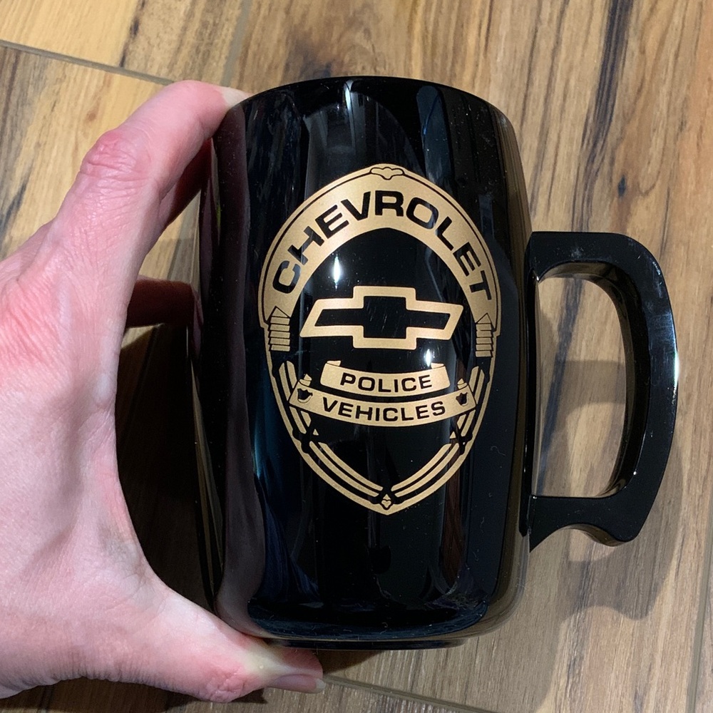 Vintage 80’s black hard plastic coffee drink mug w Chevrolet and police logo
